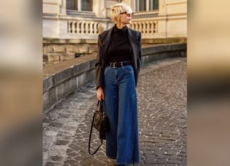 So lieber nicht! Die häufigsten Styling-Fehler bei Wide-Leg-Hosen Genau richtig: Dunkelblaue Wide-Leg-Jeans sind im Trend. Dazu passen ein enges Oberteil und ein Taillengürtel perfekt. / Source: Victoria Fox/Shutterstock.com